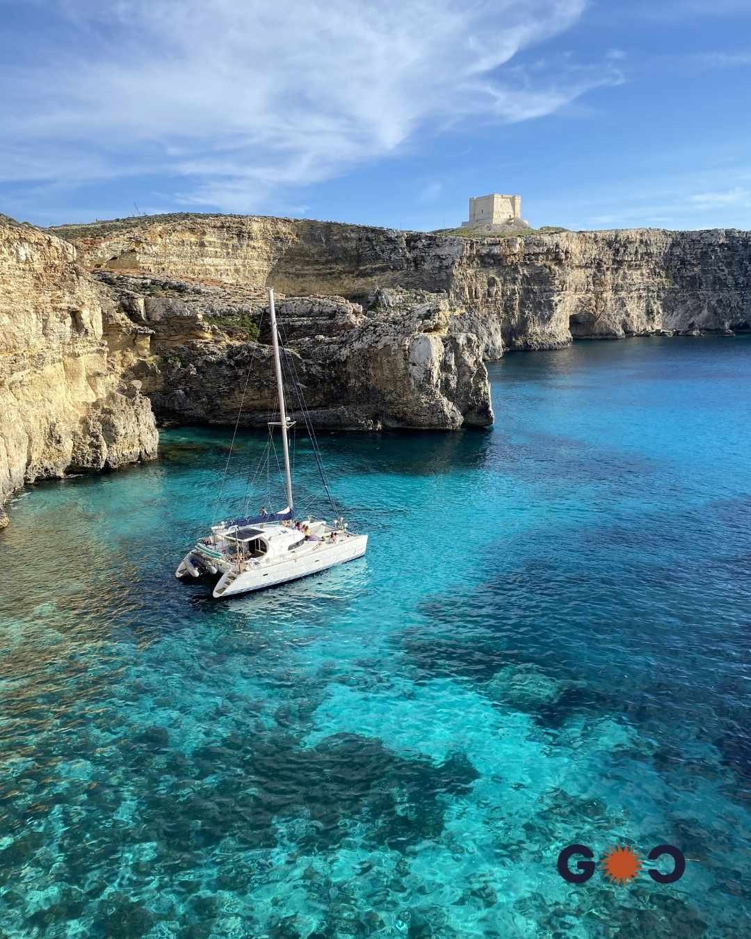 hiking over turquoise waters in Comino island, Malta