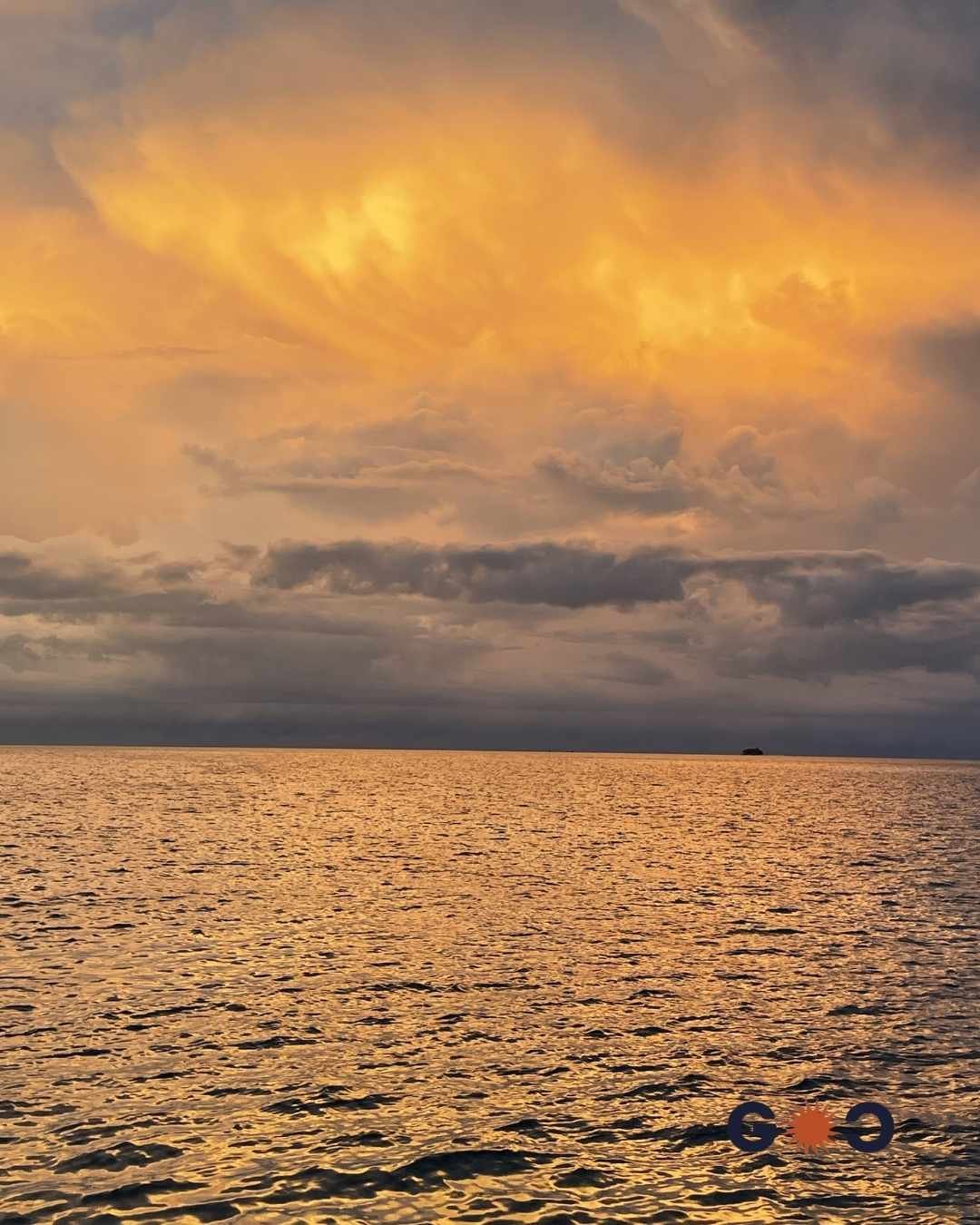 orange sunset sky and sea from a boat in Maldives